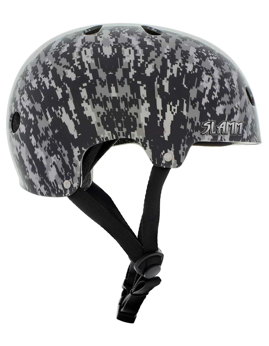 The Slamm Logo Skate / Scooter Helmet - Grey Camo boasts a striking black and gray digital camouflage pattern, ideal for scooter enthusiasts. Equipped with ventilation holes and adjustable chin straps, it meets EN1078 safety standards. The helmet prominently features the word "Slam" on one side, offering both style and security.