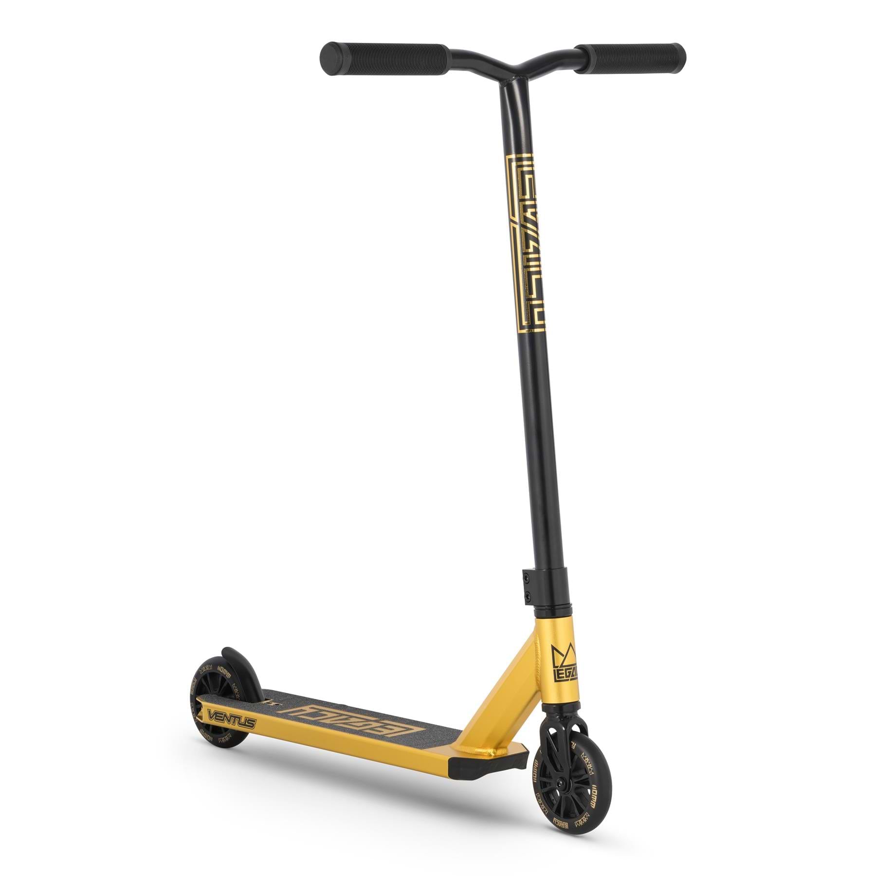 The Legacy Ventus Complete Stunt Scooter in gold and black features wide handlebars, black grips, a patterned stem, black wheels, a geometric deck design, and is perfect for the skatepark.