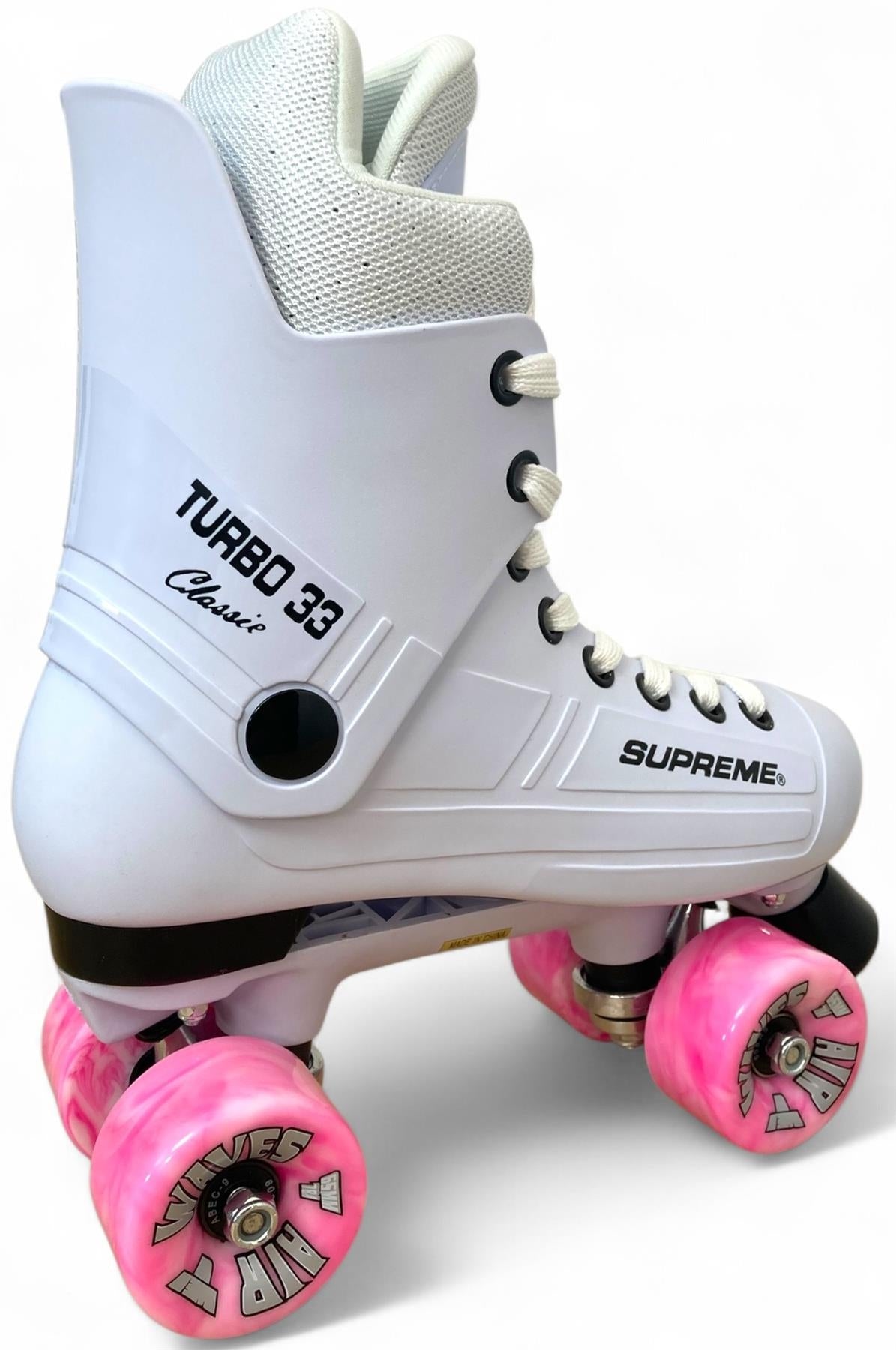 The Supreme Turbo 33 Nylon Quad Roller Skates in white feature pink swirl wheels, bold branding, and white laces. Inspired by the iconic Turbo 33 design, these skates showcase standout Supreme style against a plain background.