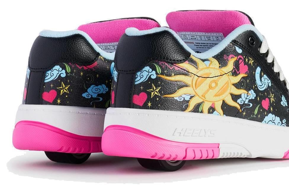 Heelys Kolect Prints Girls Shoes by Heelys feature black uppers with blue and neon pink accents, colorful prints, glow-in-the-dark details, visible heel wheels, bright pink interiors, and vibrant soles.