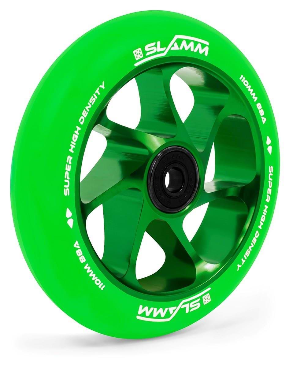 The Slamm Team 110mm Stunt Scooter Wheel - Green/Green features a bright green, high-rebound PU wheel with five metallic aluminium core spokes, black bearing, and white "SLAMM 110MM 88A SUPER HIGH DENSITY" text around the edge.