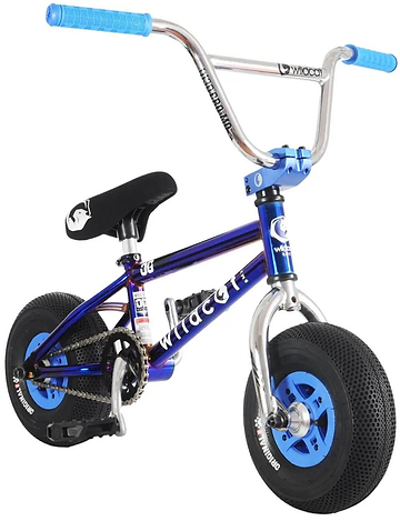 The Wildcat OG Original 3A Mini BMX Bike - Royal Blue by Wildcat features a compact metallic blue frame, PRO Street 65PSI tyres, light blue rims, 4130 chromoly steel handlebars with blue grips, and a black seat with a white graphic—perfect for trick riding.