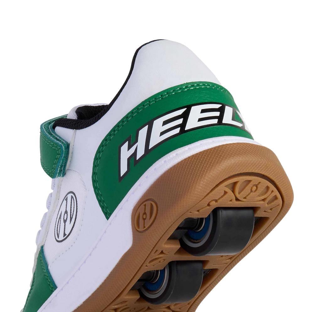 Close-up of the heel on Heelys Rezerve Low X2 Boys Shoes in white, green, and gum, showing "HEEL" on the back and a two-wheel design—fun sneakers by Heelys perfect for rolling adventures.
