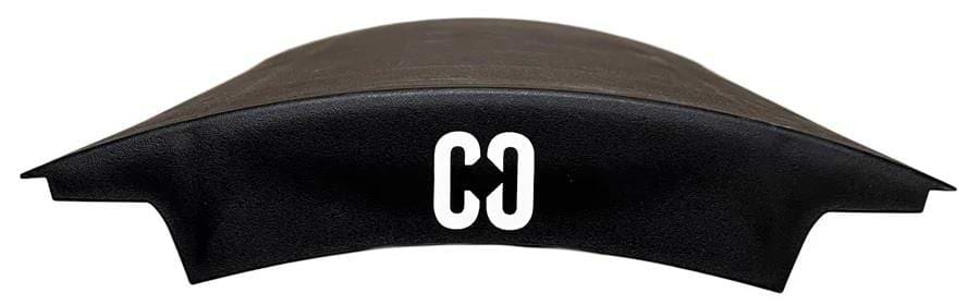 A black, curved object with a smooth surface—resembling a seamless wave-shaped skater ramp—is shown on a white background. The letters "CO" appear in white at the center of the CORE Mini Wave Skate Ramp Set - 2 Kickers & Bridge by CORE.