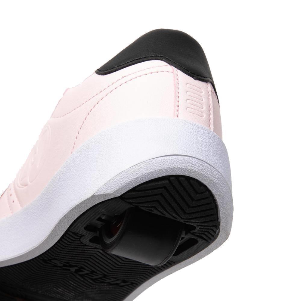 A close-up of Heelys Goleeh Girls Shoes in blush pink and black, featuring a white sole and retractable wheel in the heel, designed for skating. Brand: Heelys.