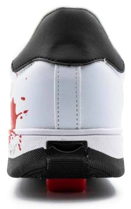 Rear view of Breezy Rollers Splash Shoes in White/Black/Multicoloured, featuring a black heel, red paint splatter accents, a red detail above the black sole, and Breezy Rollers' patented wheel system for smooth movement.