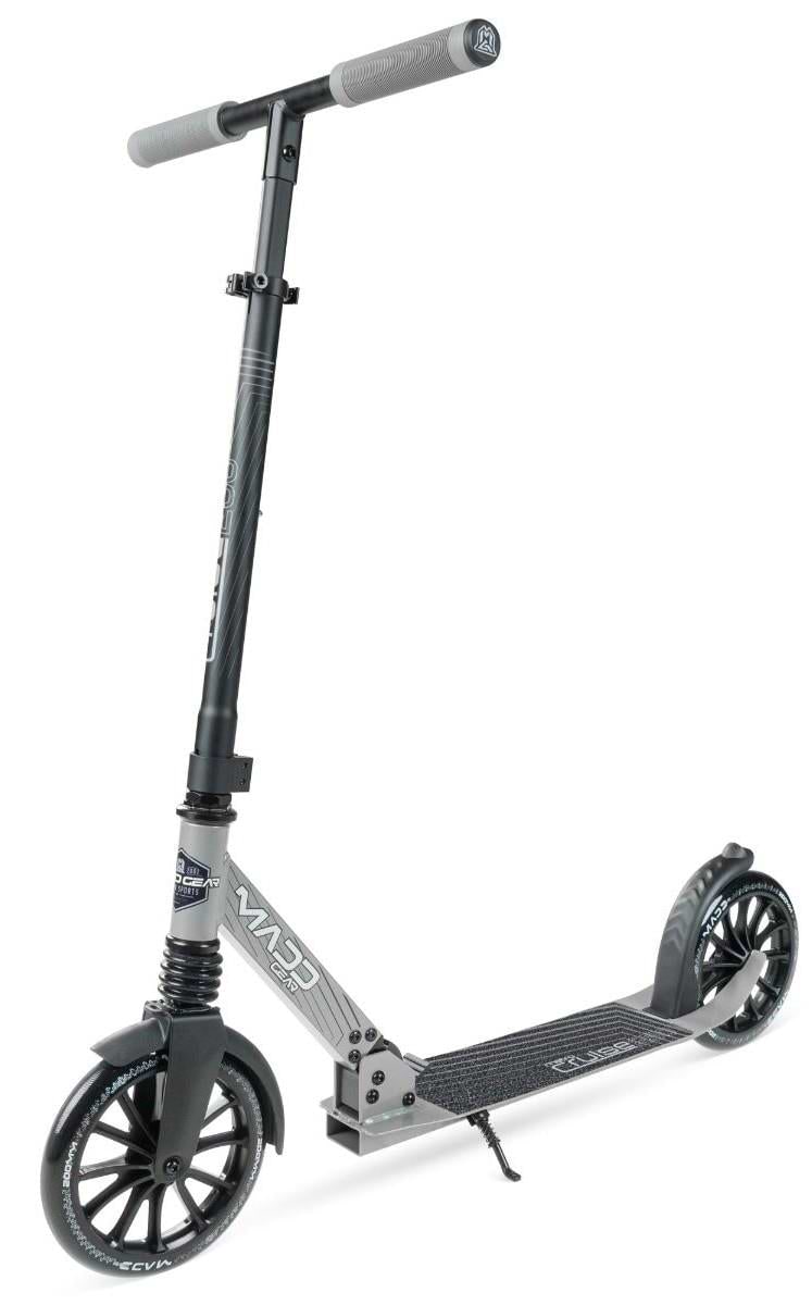 The Madd Gear Metro Cruise 250 Foldable Commuter Scooter in black and grey features large wheels, a textured foot deck, gripped handlebars, rear fender brake, and adjustable height. Shown on a white background.