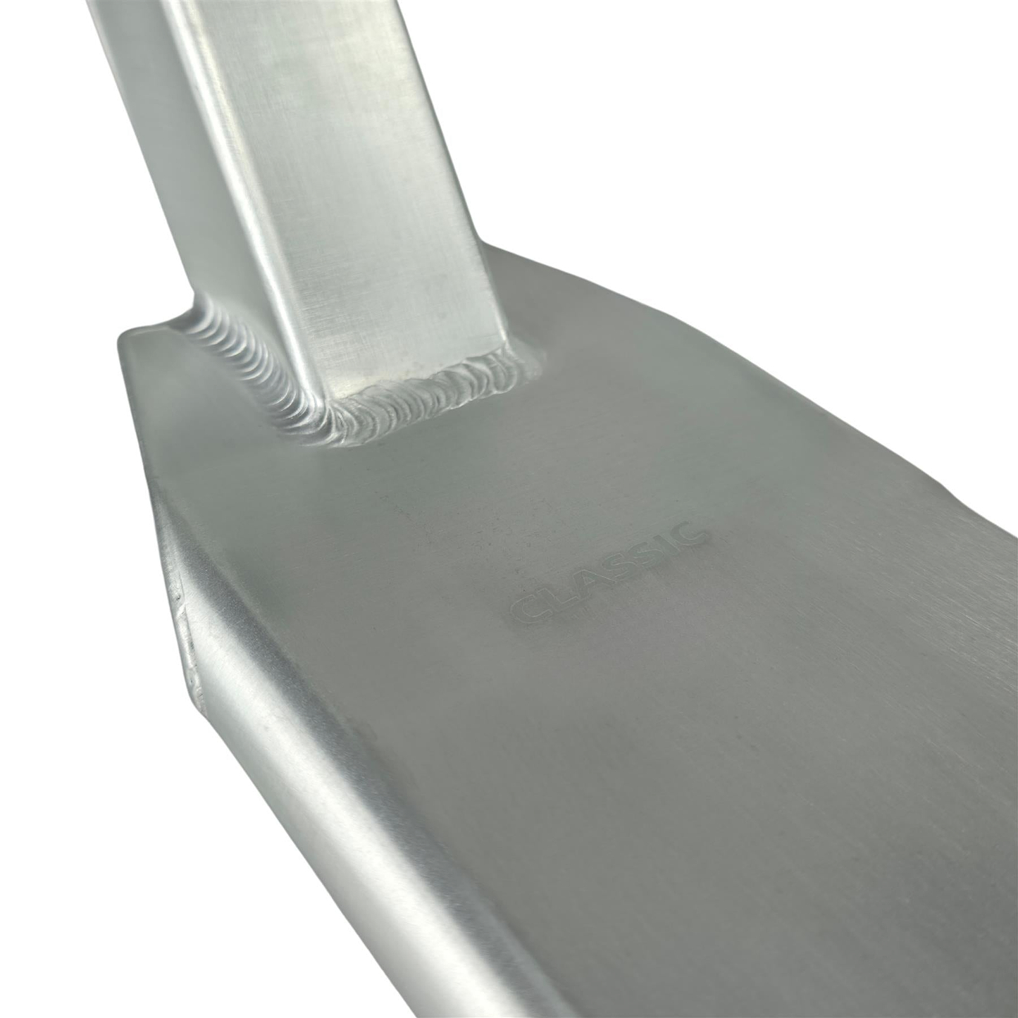 Close-up of the Union Classic Pro Silver Stunt Scooter Deck (4.75") by Union, showing smooth, shiny surfaces, visible weld lines, and a faintly engraved "CLASSIC" logo. The deck has an angular, durable design with an industrial look.