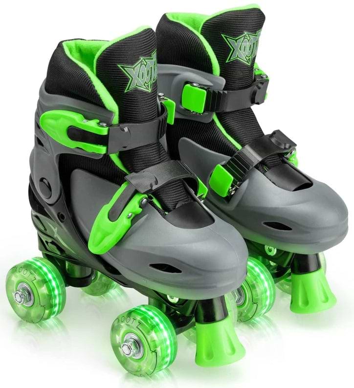 The Xootz LED Adjustable Quad Roller Skates - Green feature gray and black styling with bright green wheels and straps—ideal beginner skates for kids, shown here against a white background.
