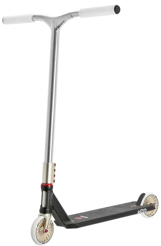 The Aztek Corsa Complete Stunt Scooter in black features silver and black coloring, white handlebars, gold wheels, and a textured foot deck, shown against a white background.