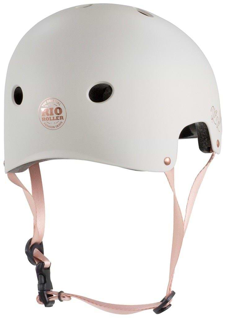 The Rio Roller Rose Skate/Scooter Helmet in cream boasts pink adjustable straps, multiple ventilation holes, and the distinctive "RIO ROLLER" logo in pink on the side, offering a chic and stylish choice for enthusiasts.