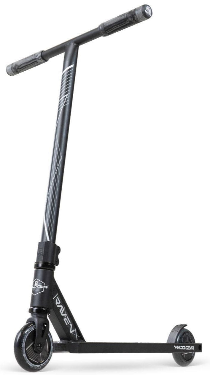 The Madd Gear MG 1 Raven Complete Stunt Scooter in Black/Black features a T-shaped handlebar, angled stem stripes, and a slim "VADER" deck for lightweight performance. It stands upright on a white background.