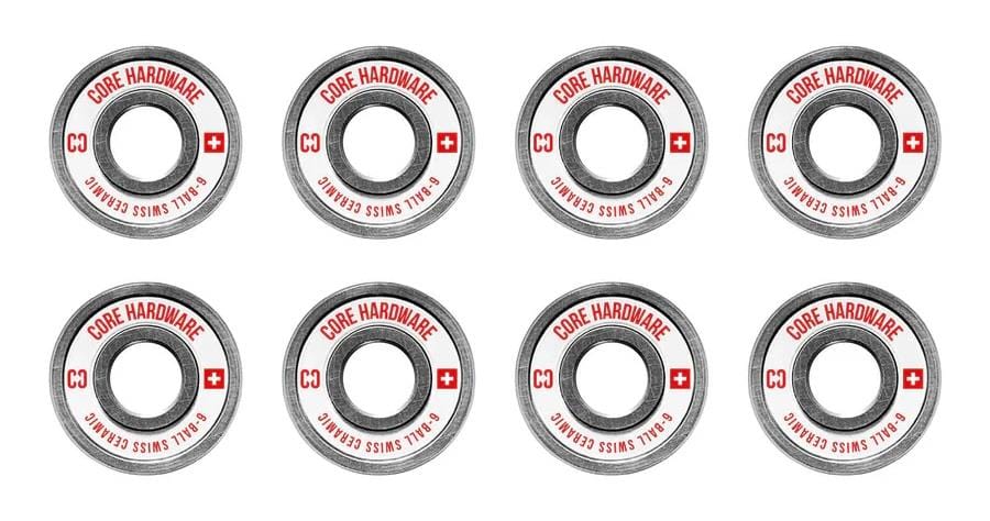 Arranged in two neat rows, the CORE Swiss Ceramic Skateboard Bearings are designed for top-notch skating performance with precise craftsmanship. Each of the eight gray bearings prominently displays "CORE SWISS" and "C3" in red next to a Swiss flag design, all set against a clean white background.