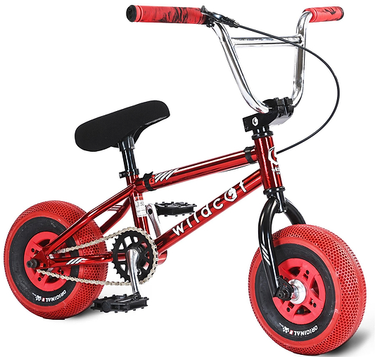 The Wildcat OG 3A Mini BMX Bike - Royal Red features a small red and black frame with "wildcat" in white, thick treaded PRO Street 65PSI tyres, CNC aluminium wheel rims, a black seat, and red handlebar grips for durability and style.