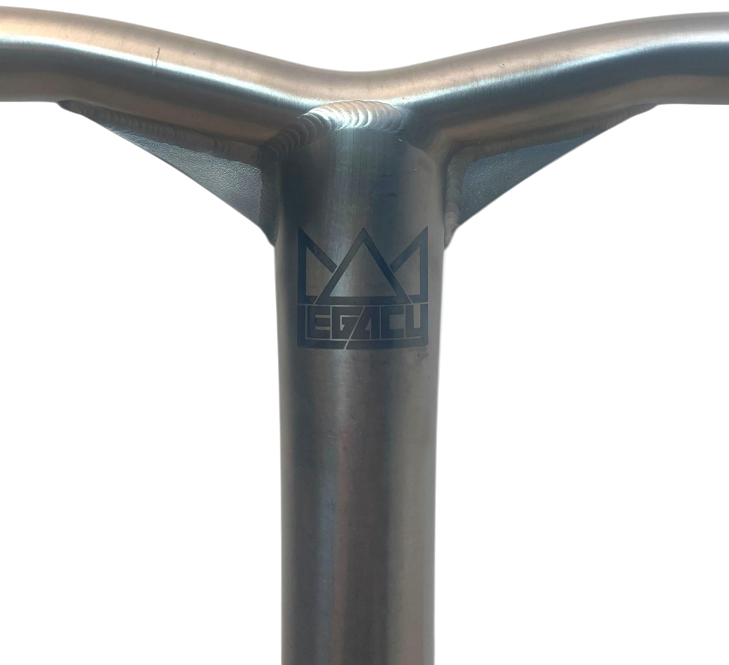 Close-up of the Legacy Gusset Titanium Oversized HIC Stunt Scooter Y-Bars (Chrome, 660mm x 600mm) featuring a metallic finish, welded joint, and black "LEGACY" logo with geometric crown shapes on a plain white background.