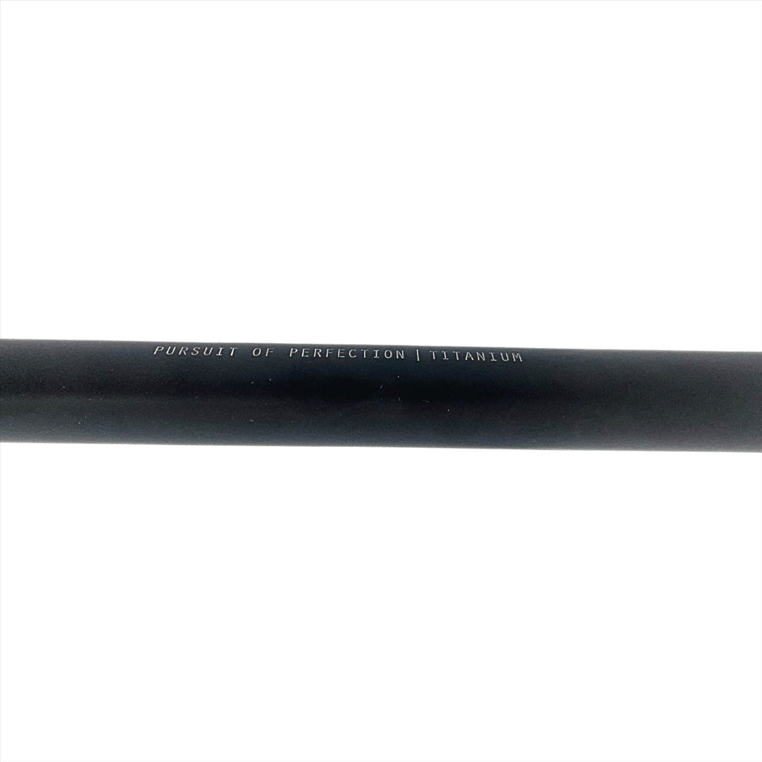 A close-up of Root Industries AIR Titanium Oversized HIC Stunt Scooter T-Bars in black, measuring 690mm x 600mm, showcases the text "Pursuit of Perfection Titanium" engraved on their surface. The plain white background emphasizes the inscription and highlights the sleek design of these lightweight handlebars.