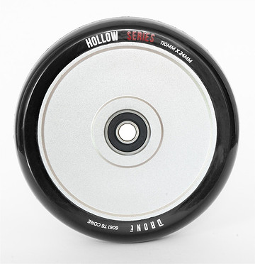 Close-up of the Drone Hollow Series 110mm Stunt Scooter Wheel - Silver, featuring its durable circular design. It has a central hub with a smooth, reflective surface, and its size (110mm x 24mm) is marked on it.