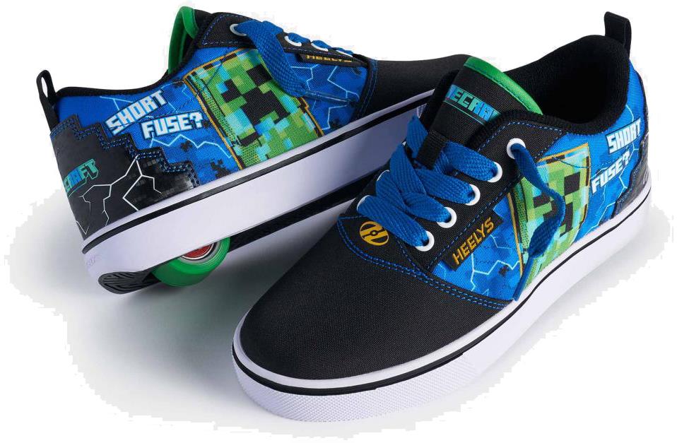 The Heelys x Minecraft Pro 20 Boys Shoes by Heelys feature black, blue, and green colors with Creeper-inspired pixel graphics and "SHORT FUSE?" on the sides. One shoe includes a signature wheel in the heel.