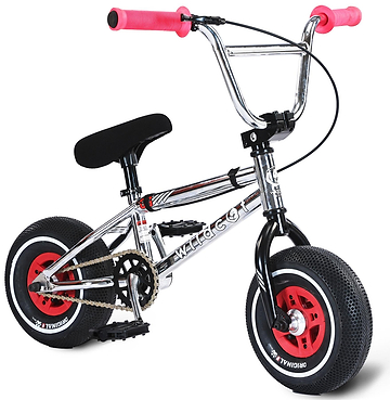 The Wildcat OG 3A Mini BMX Bike - Galaxy Red by Wildcat features thick black PRO Street 65PSI tyres, CNC aluminium red rims, black pedals and seat, and pink handlebar grips. Shown against a white background.