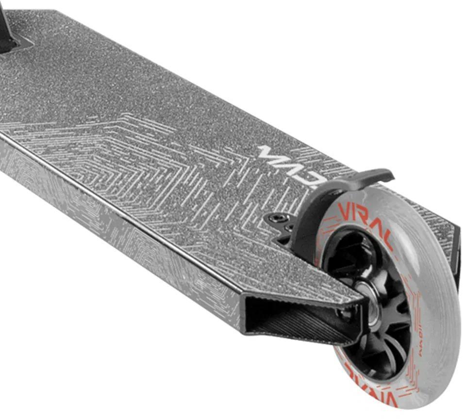 Close-up of the rear section of the Madd Gear Viral Extreme Stunt Scooter in Black Shadow, showing a textured deck, black brake, and translucent rear wheel with red “Viral” branding—ideal for skatepark setups.