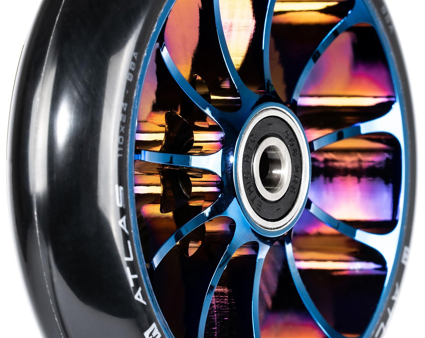 Close-up of the Ethic DTC Atlas 110mm Stunt Scooter Wheel in Chrome Blue, featuring a shiny metallic core with rainbow hues, black rubber outer layer, lightweight build, thin blue spokes, and a visible center bearing.