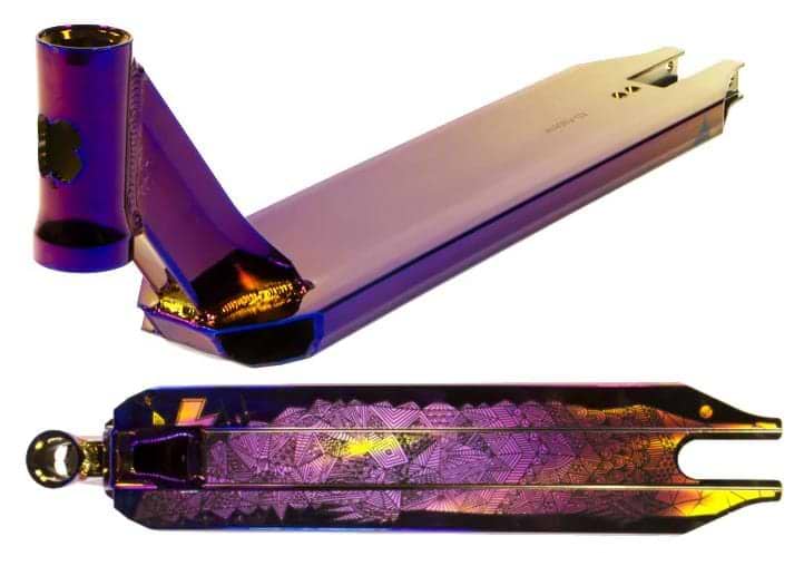 The Lucky Covenant Neo Purple Stunt Scooter Deck by Lucky, sized 4.5" x 20.5", features an iridescent purple and gold finish with engraved geometric patterns—ideal for pro riders seeking a premium upgrade.