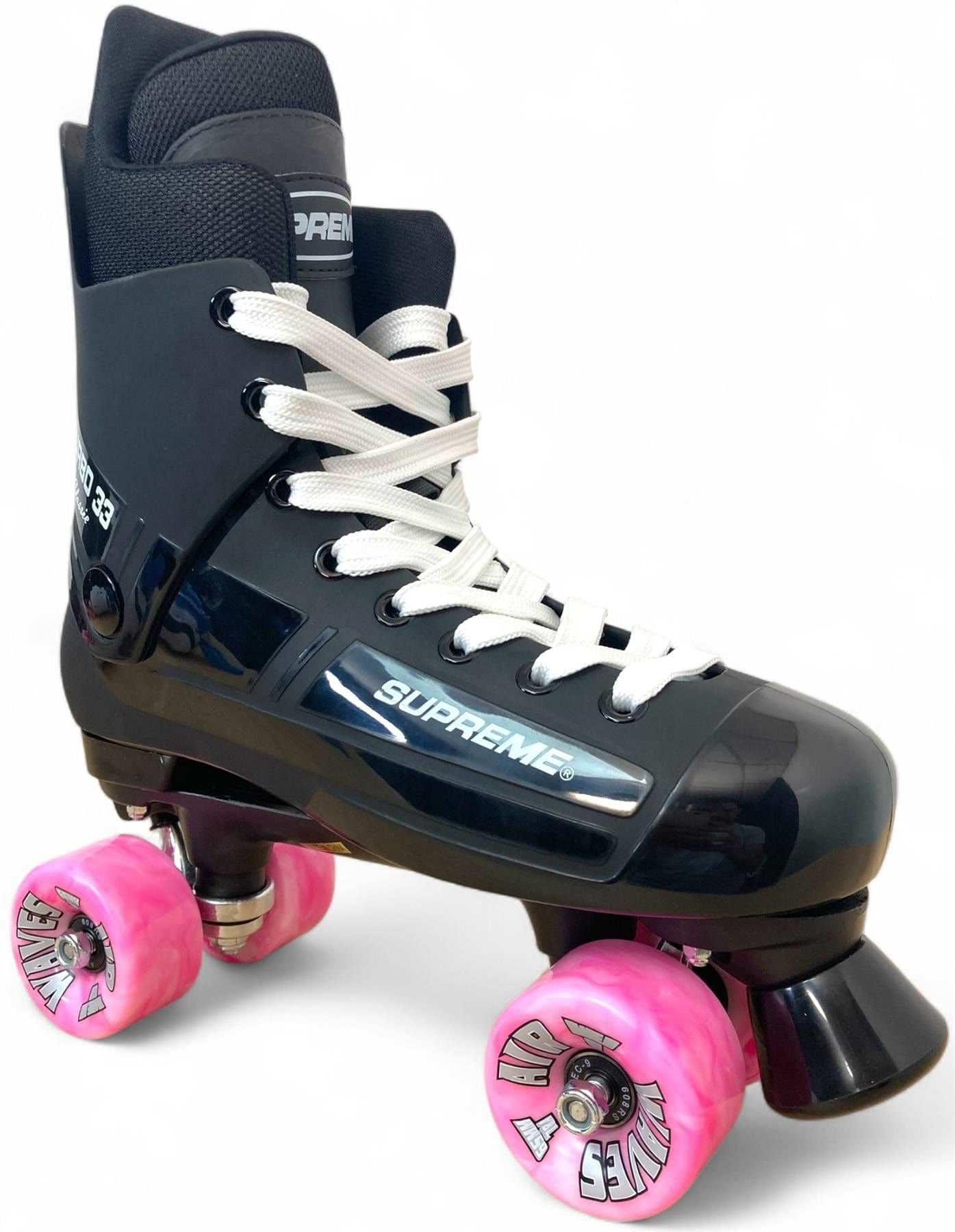 The Supreme Turbo 33 Nylon Quad Roller Skates in black feature white laces, silver branding, and four pink swirl wheels, shown against a plain white background.
