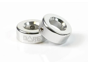 Two chrome Dare CNC Aluminium Scooter Bar Ends by Dare, featuring a round design engraved with "DARE SPORTS CO.," are displayed on a white surface—one standing upright, the other lying flat.