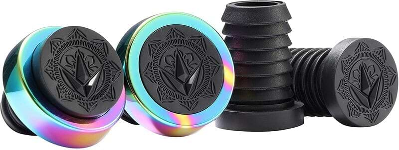 Colorful ear gauges with black tops showcasing a geometric design, ideal for fans of Blunt Envy, feature linings with a rainbow gradient. These are paired with black silicone tunnels set against a plain white background, reminiscent of the vibrant style found in Blunt Envy Halo Stunt Scooter Bar Ends - Oil Slick Neochrome.