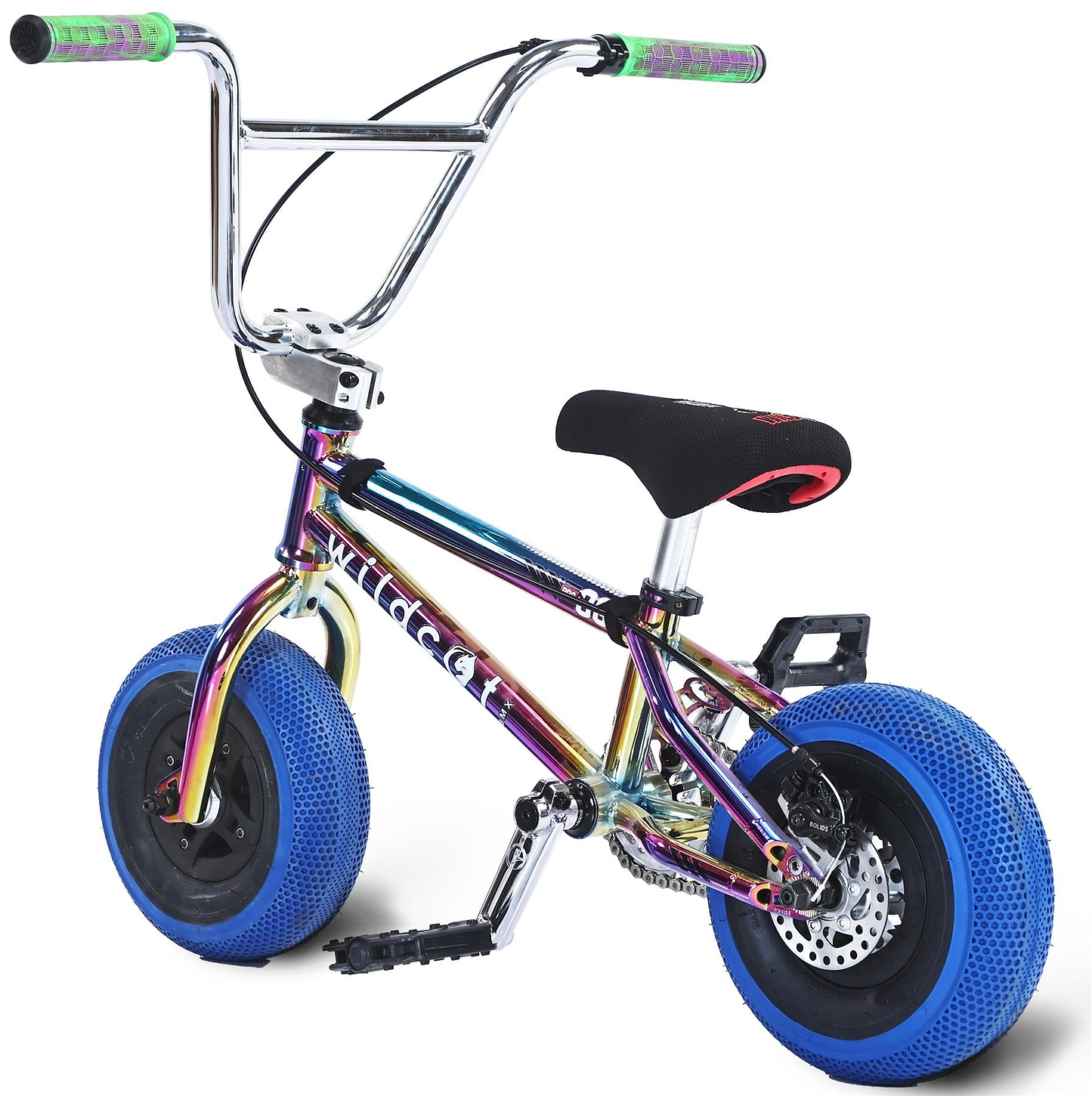 The Wildcat OG Pro Mini BMX Bike - Joker Blue Neochrome features a shiny rainbow frame, bold blue turbo wheels, black seat and pedals, and green handlebar grips, shown at an angle on a white background.
