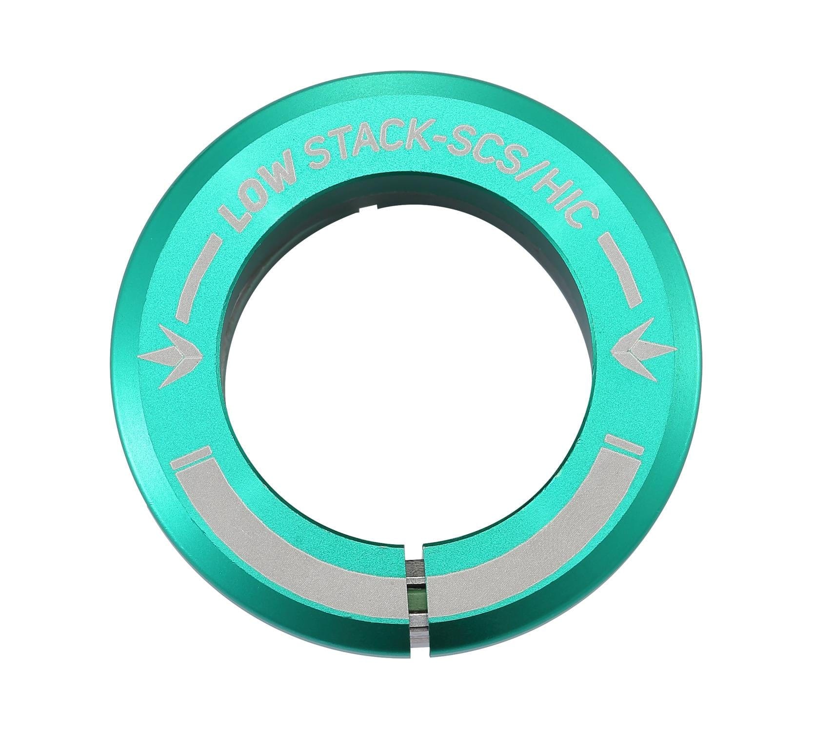 The Blunt Envy Low Stack SCS Integrated Stunt Scooter Headset in teal is a circular metal clamp with an engraved "LOW STACK-SCS/HIC" that boasts a split design for easy installation. It's ideal for securing scooter handlebars, particularly when paired with a stunt scooter using an SCS compression system.