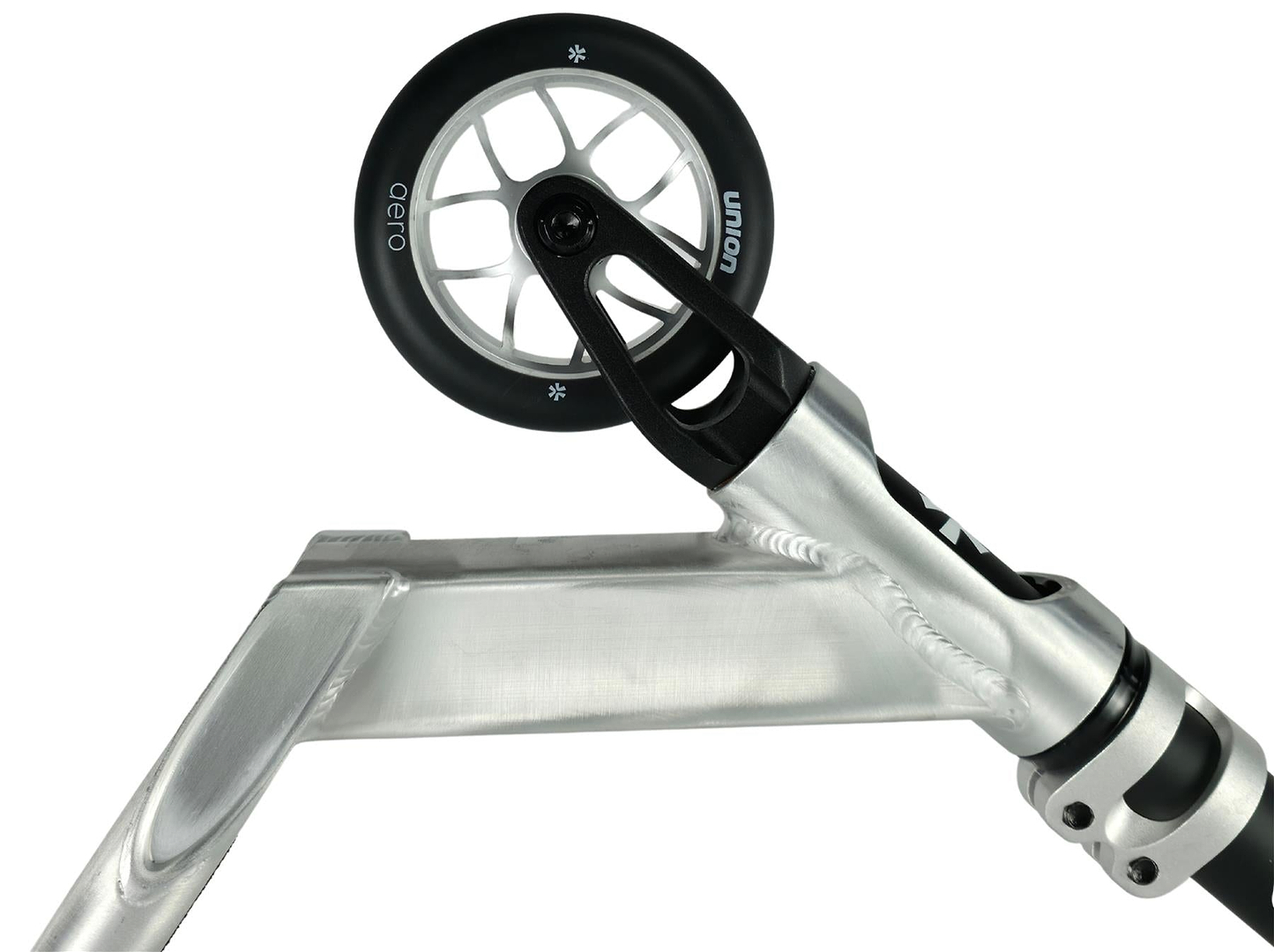 Close-up of the Union Aero Complete Stunt Scooter by Union in Black / Raw, highlighting the front wheel, fork, metal deck, clamp, and black wheel with white spokes against a white background.