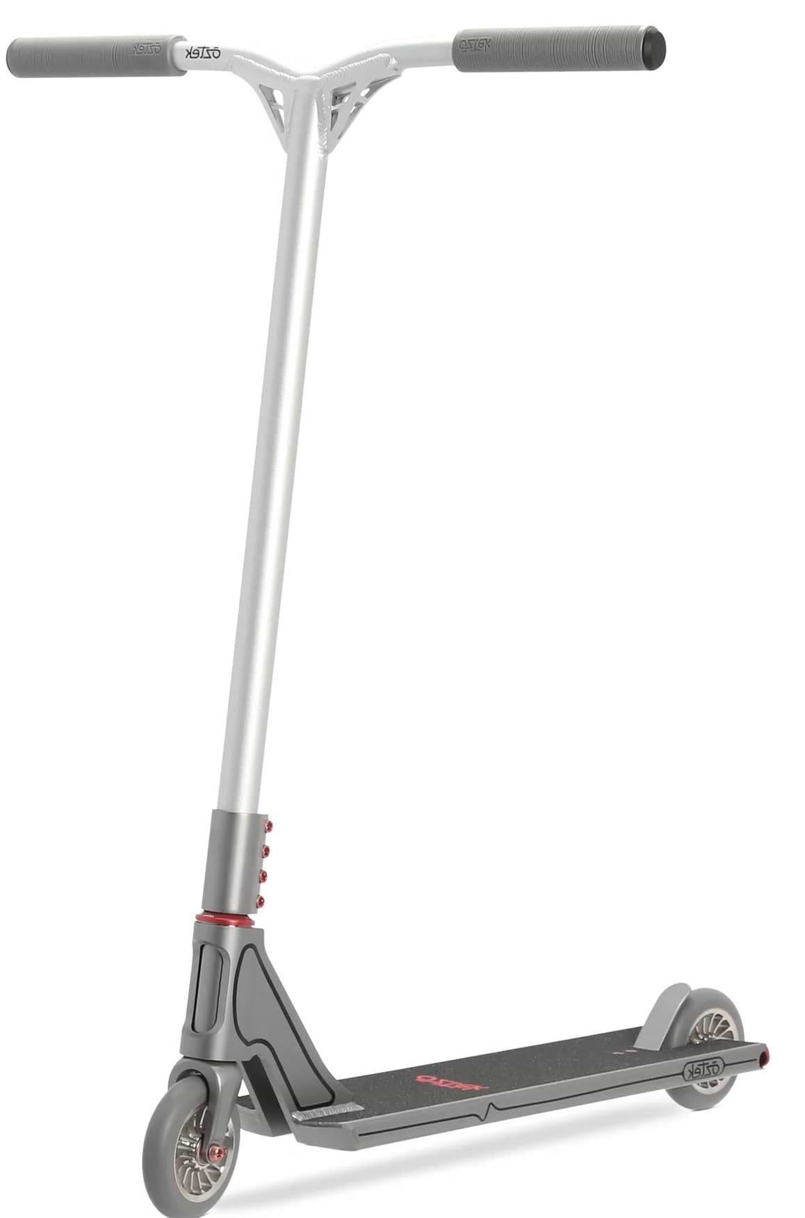 The Aztek Fountain Complete Stunt Scooter - Grey features a silver and black design, T-shaped handlebar with black grips, small wheels, wide deck, red base accents, and a sleek skatepark-ready look.