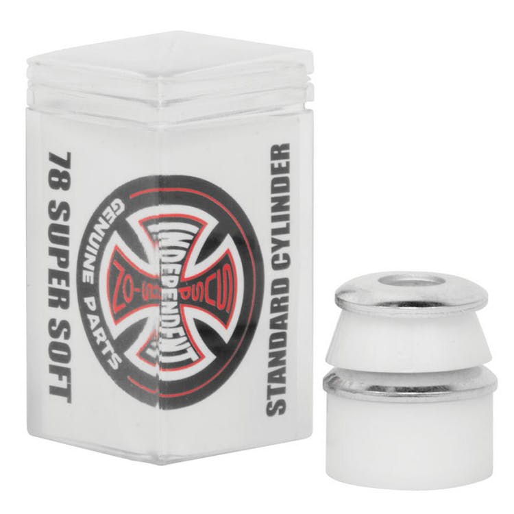 A transparent box with a label of "Independent Standard Cylinder White Skateboard Bushings - 78A" displays bushings celebrated for their premium urethane formula. The packaging features a black and red logo with a cross design, while two cylinder bushings are placed next to the box, ensuring exceptional performance.
