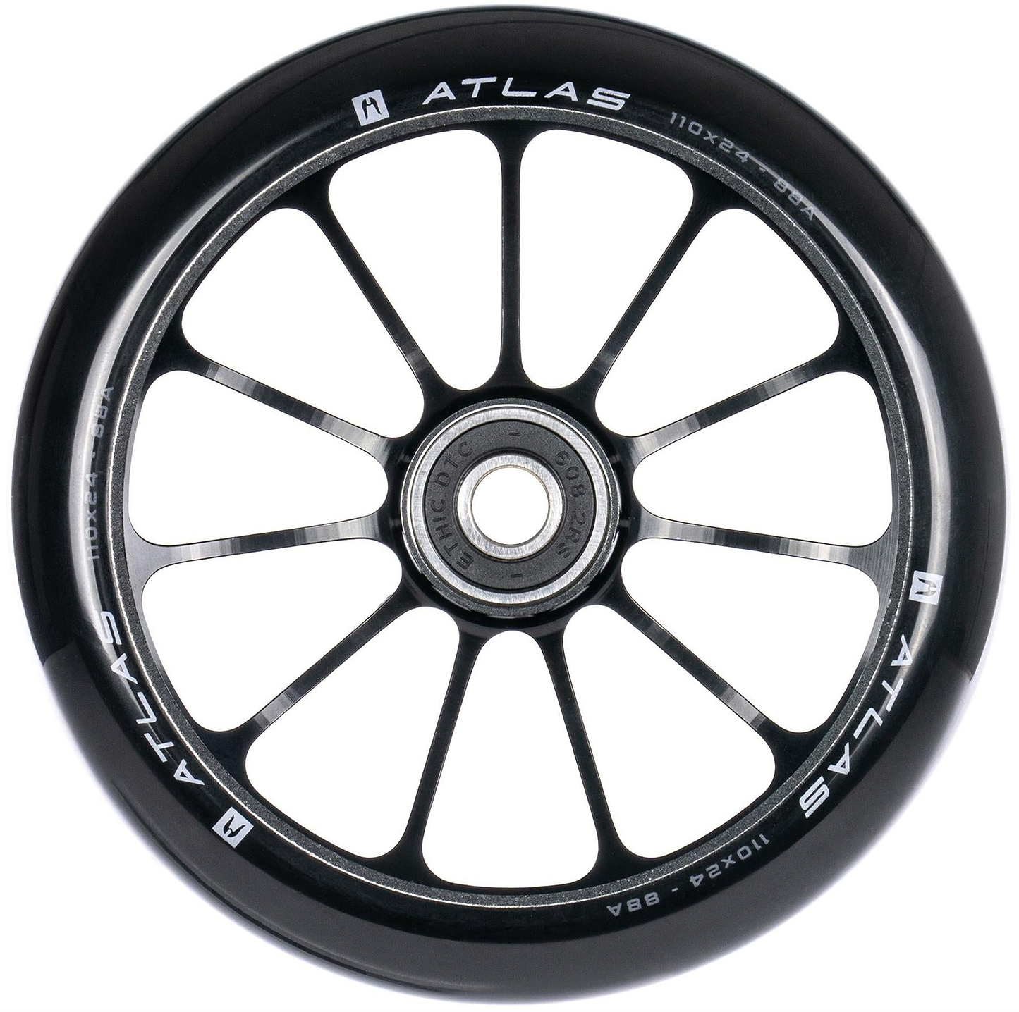A close-up of the Ethic DTC Atlas 110mm Stunt Scooter Wheel in black, showing its twelve-spoke design, central bearing, and white specs on the rim. This lightweight performance wheel is made by Ethic.