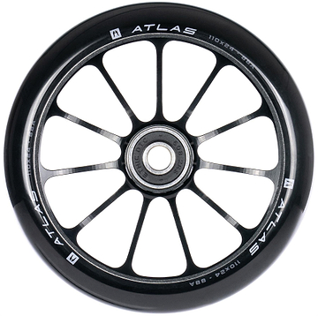 A close-up of the Ethic DTC Atlas 110mm Stunt Scooter Wheel in black, showing its twelve-spoke design, central bearing, and white specs on the rim. This lightweight performance wheel is made by Ethic.