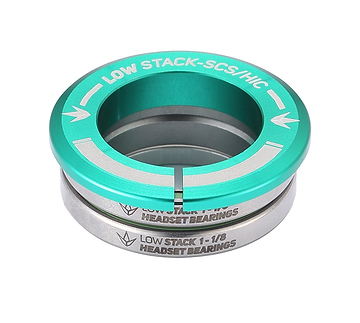 A teal, silver, and green circular metal component from Blunt Envy labeled "Low Stack SCS Integrated Stunt Scooter Headset" and featuring sealed bearings for durability, intended for use in a stunt scooter headset assembly with the SCS compression system.