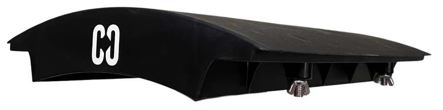 A black plastic device with a curved top, labeled "CORE" in white, features adjustable metal screws underneath—perfect for skaters wanting the CORE Mini Wave Skate Ramp Set with 2 kickers and bridge.