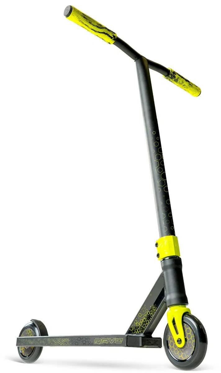 The Madd Gear Viral Rave Complete Stunt Scooter - Neon by MGP features a T-shaped handlebar, small wheels, and geometric patterns on the grips, fork, and deck. This kids scooter in black and yellow is shown upright against a white background.