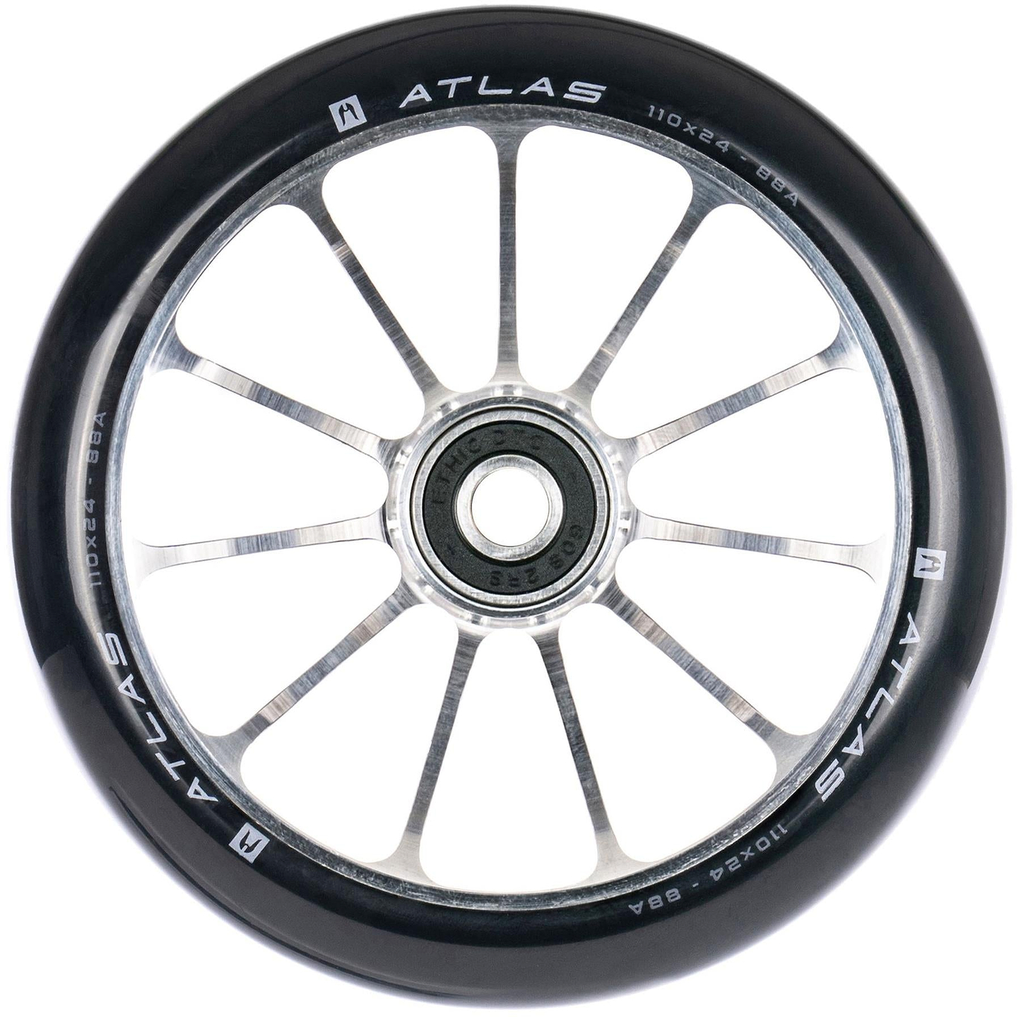 A close-up of the Ethic DTC Atlas 110mm Stunt Scooter Wheel - Raw shows its black and silver finish, ten metal spokes, central bearing, and white Ethic branding with size details on the lightweight rim.