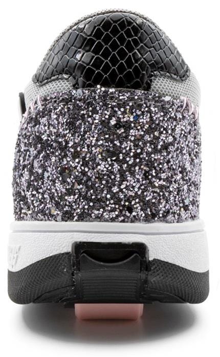 Close-up of the Breezy Rollers Star Shoes - Silver / Grey by Breezy Rollers, featuring a glittery heel, gray and black mesh upper, white midsole with black and pink accents, and a patented wheel system for smooth transitions.