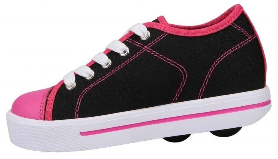 The Heelys Classic X2 Girls Shoes in black, white, and hot pink feature a Canvas/Nylon upper, white laces, a thick white sole with a pink stripe, and two low-profile wheels in the heel for rolling fun.