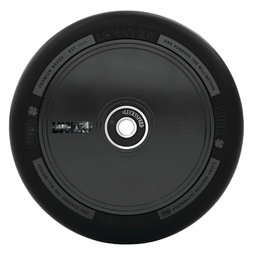 The Lucky Lunar 110mm Stunt Scooter Wheel - Shadow features a sleek black design with subtle decorations from above, showcasing "Lucky" branding and specs around its rim. Its circular metal core highlights the outstanding craftsmanship of Lucky Rebound Technology.