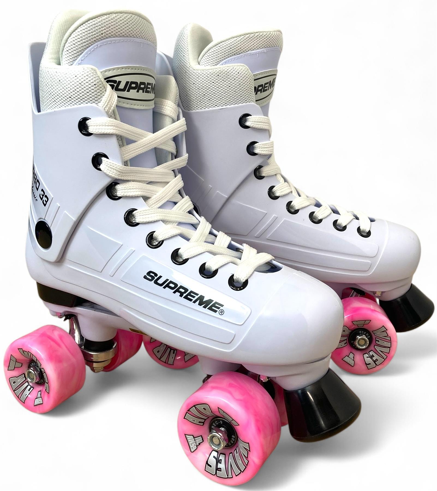 A pair of Supreme Turbo 33 Nylon Quad Roller Skates in white, featuring pink swirl wheels and black toe stops, displayed against a plain white background.