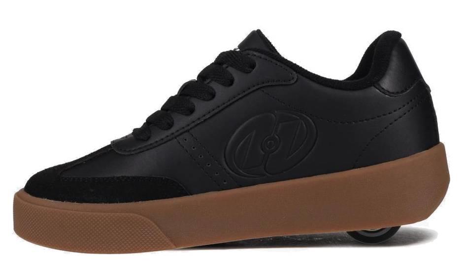 The Heelys Goleeh Boys Shoes in Black/White/Gum feature a low-top court style with black laces, a brown gum sole, and a hidden wheel in the heel, making them a classic choice from Heelys.