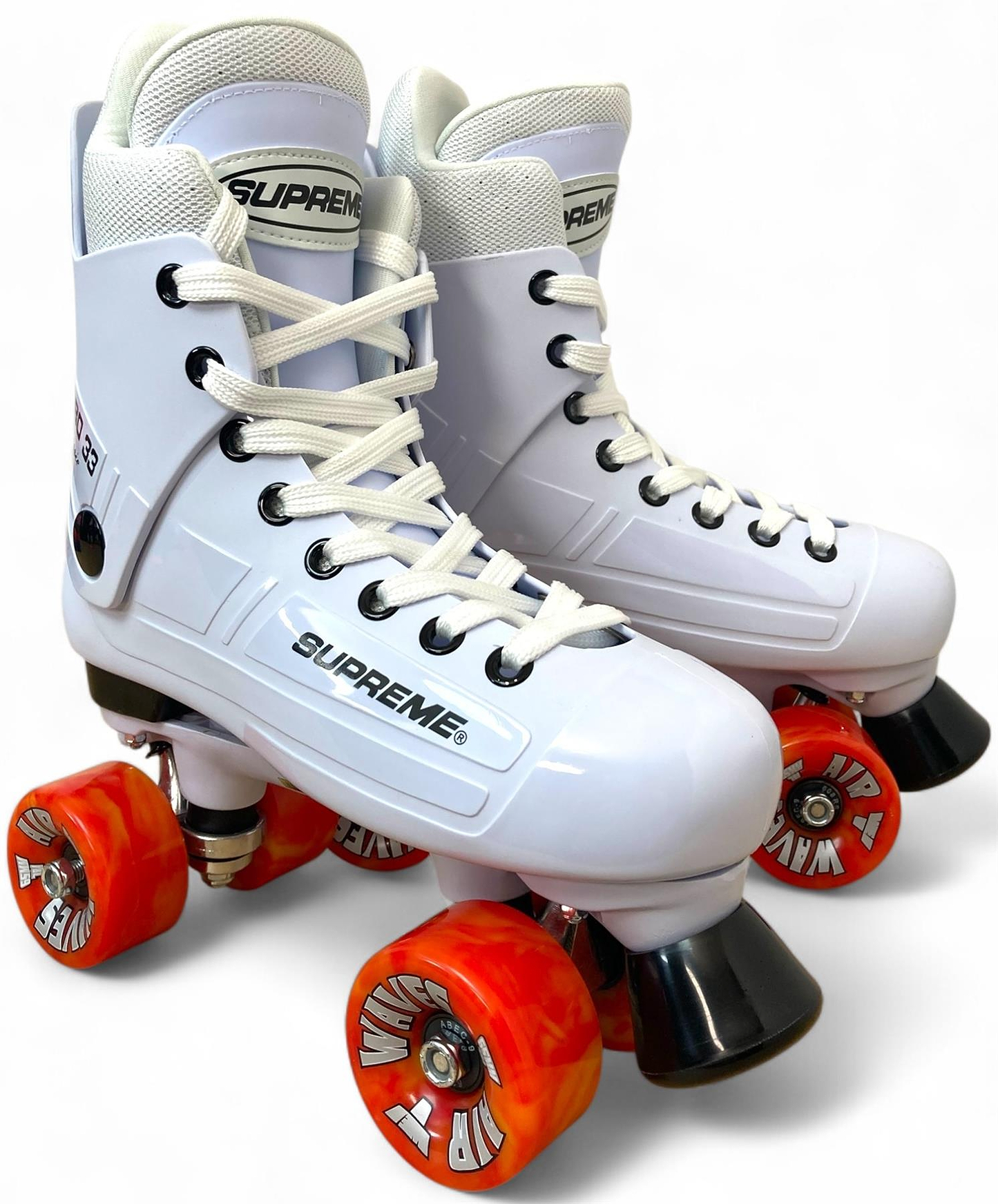 The Supreme Turbo 33 Nylon Quad Roller Skates feature high-top white boots, black accents, white laces, and red swirl wheels, all inspired by classic designs. Displayed against a plain white background.