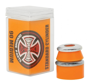 The image showcases Independent Standard Cylinder Orange Skateboard Bushings - 90A, made from high-rebound urethane, next to a transparent plastic box featuring the "Independent Genuine Parts" logo and labeled with "Standard Cylinder.
