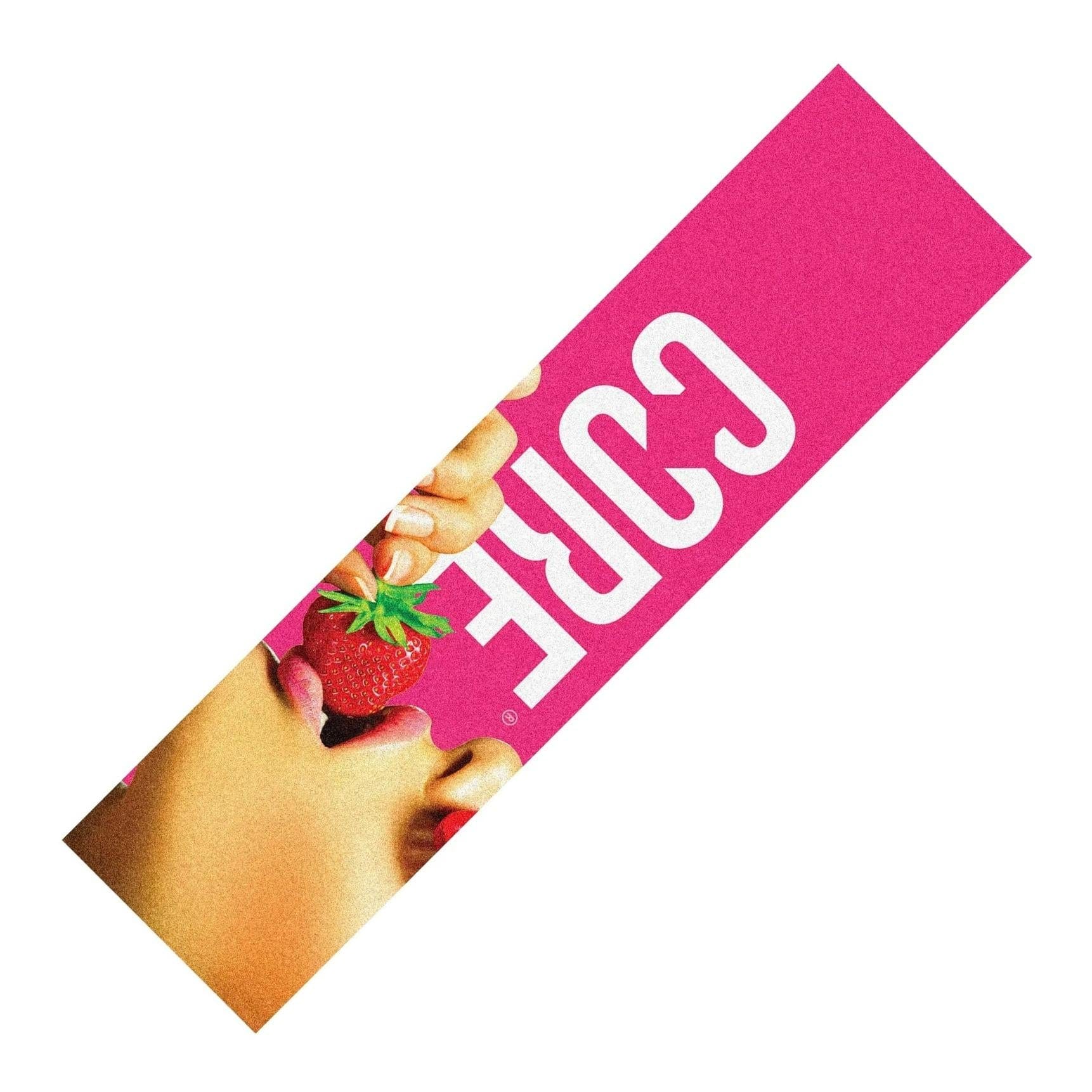 A pink poster showcases a close-up image of someone holding a strawberry near their mouth, highlighting the ultimate grip. The word "CORE" is prominently featured in white letters, illustrating the precision of CORE Stunt Scooter Griptape - Lips.