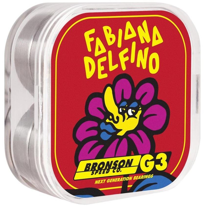 A rectangular container of Bronson Speed Co. Fabiana Delfino Pro G3 Skateboard Bearings features a vibrant red and yellow floral lid design, with "Fabiana Delfino" displayed above a comic-style flower illustration.