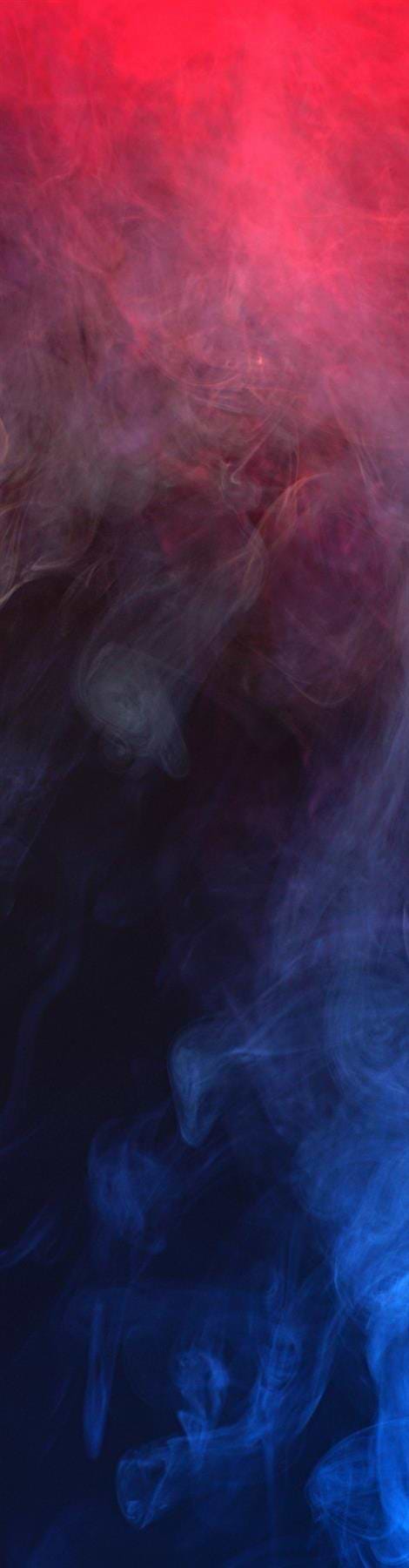 The vertical image showcases colorful smoke blending like Legacy Smoke Stunt Scooter Griptape - Pink/Blue, with vivid red hues transitioning into dark tones at the top and deep blue at the bottom, creating an abstract effect reminiscent of Legacy's ethereal design.
